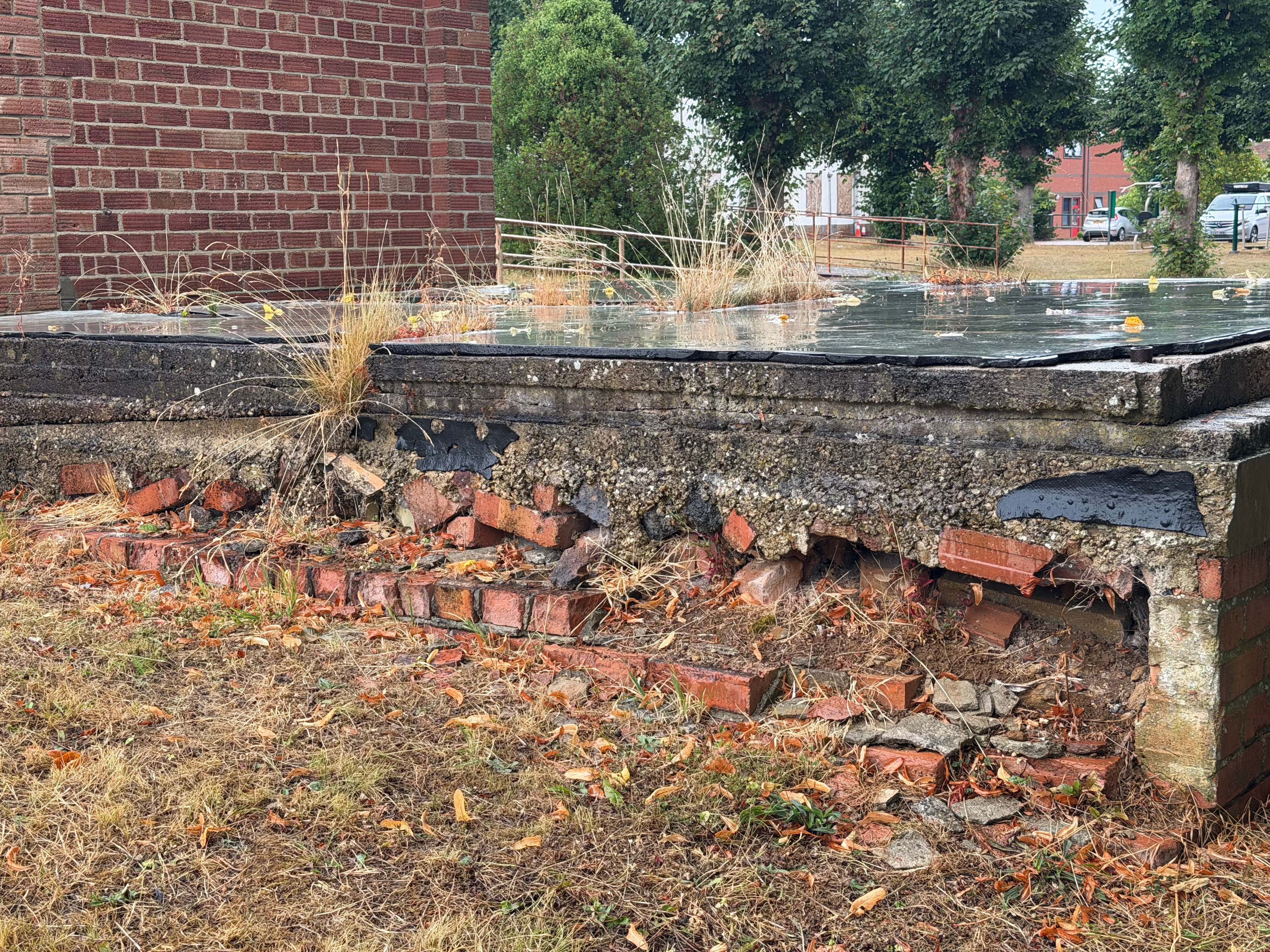 Damaged brickwork and neglected paving at Horton General Hospital