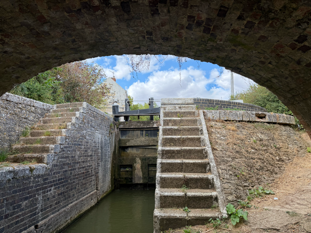 Grant's Lock (30) on the Oxford Canal, showing the stone bridge arch, lock structure and stepped towpath
